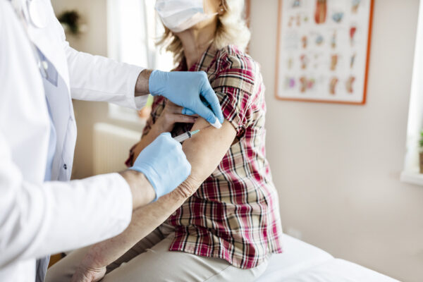 woman-receiving-covid-vaccindation