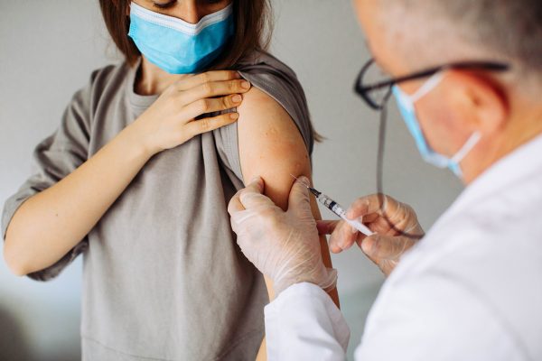 Woman-receiving-vaccination