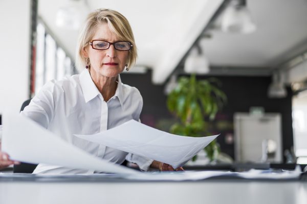 Woman-looking-at-financial-documents