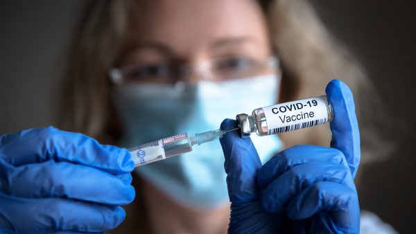 woman-administering-the-covid-vaccination